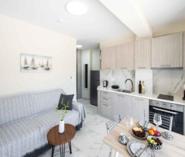 A comfortable and stylish living area designed for relaxing moments during your Lefkada holiday. Bright living room with sofa bed at Aurelia Apartment in Nikiana Lefkada
